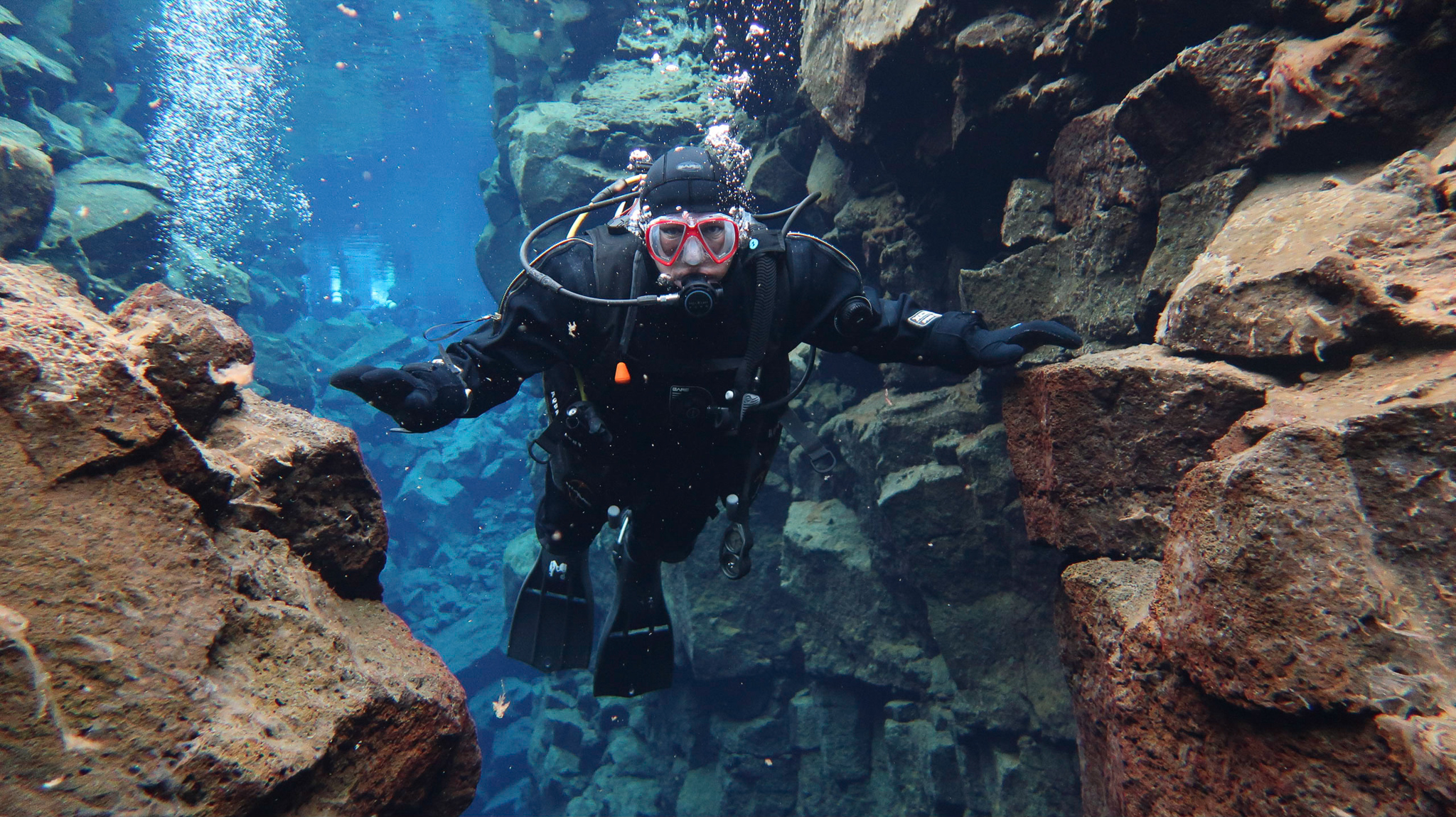 Europe on one side, North America the other while scuba diving at Silfra Fissure in Thingvellir National Park, Iceland. Photo by Tania Roque of DIVE.IS